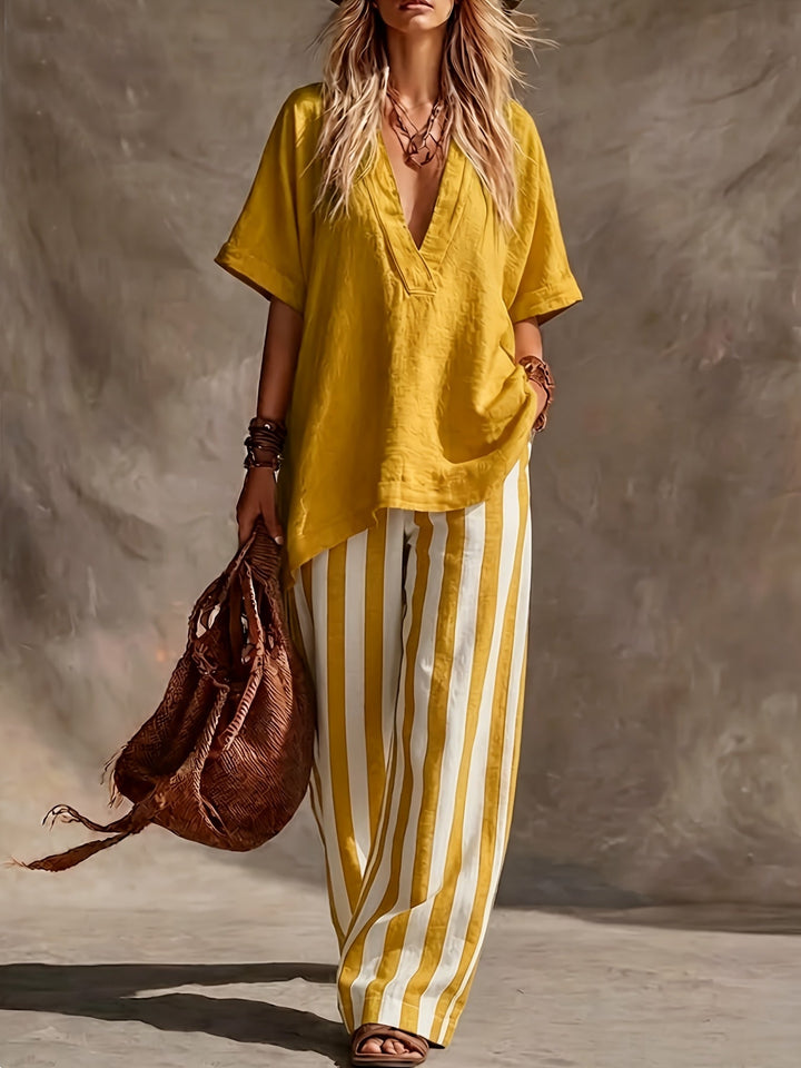 Relaxed fit V-neck top and striped wide leg pants, perfect casual summer outfit for women.
