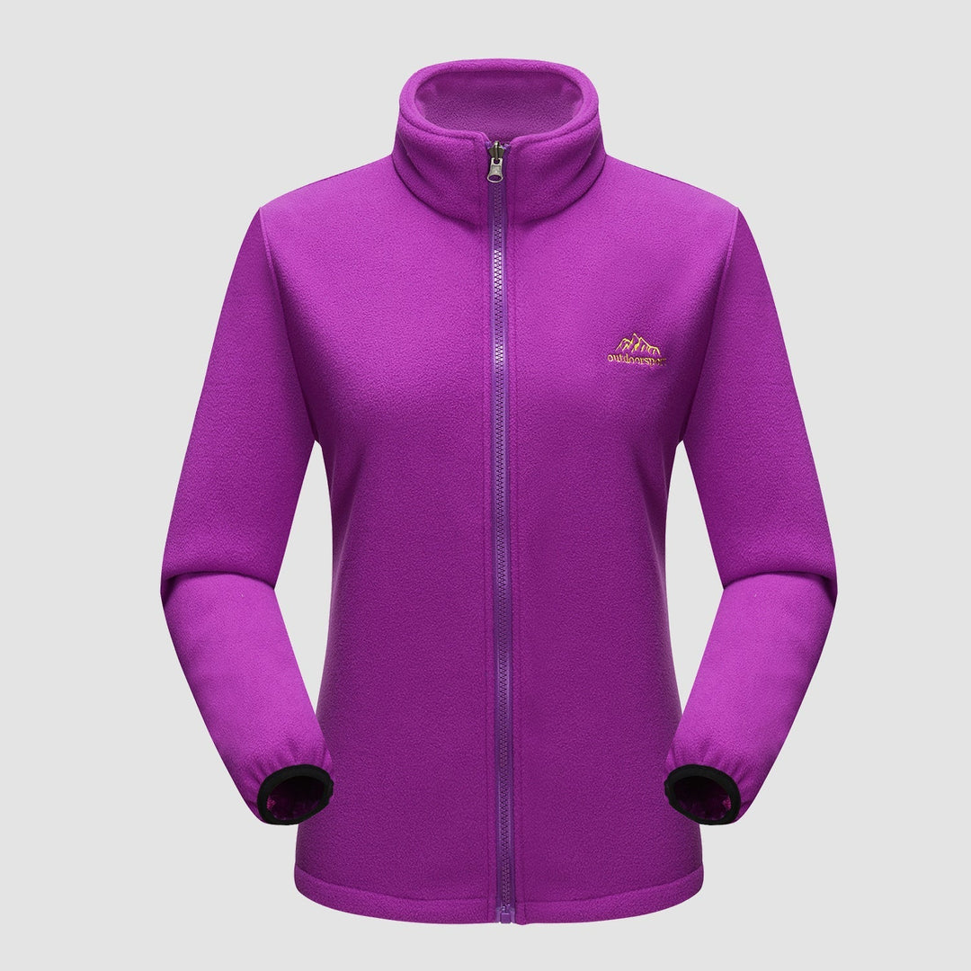 Woman enjoying hot beverage, cozy in her Verona 3-in-1 waterproof jacket, an essential winter coat.