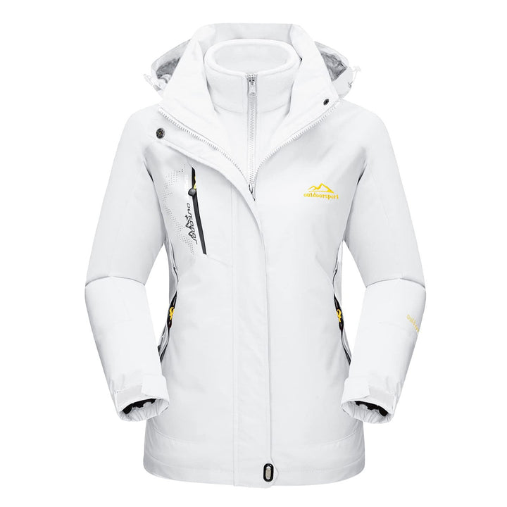 Outdoor shot of a woman hiking in a grey Verona 3-in-1 waterproof jacket, perfect fall & winter coat.