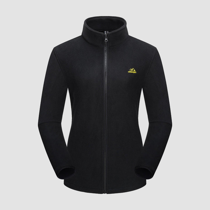 The Verona 3-in-1 women's jacket in a deep forest green, blending with nature, perfect outdoor wear.
