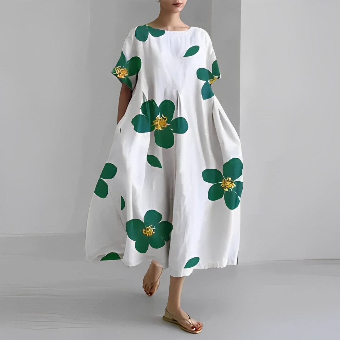 Flowy women's vibrant floral maxi dress, perfect casual summer fashion for vacation comfort.