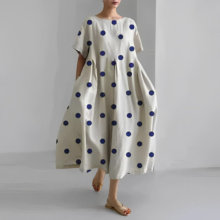 Detail of the neckline on a women's vibrant floral maxi dress, a comfortable summer fashion piece.
