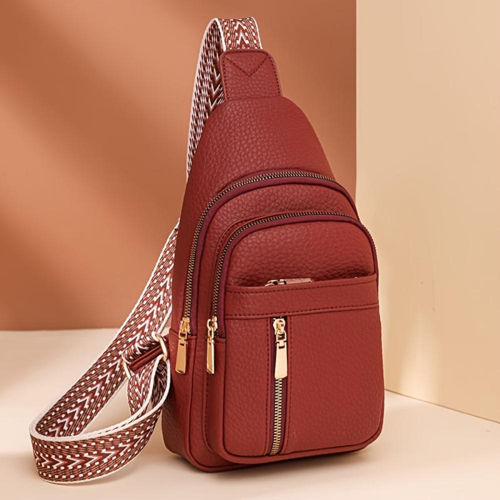 Classic front view of a women's vintage brown leather chest crossbody bag.
