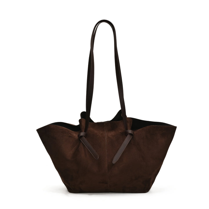 Close-up of women's vintage faux suede tote handbag texture, soft material, elegant design