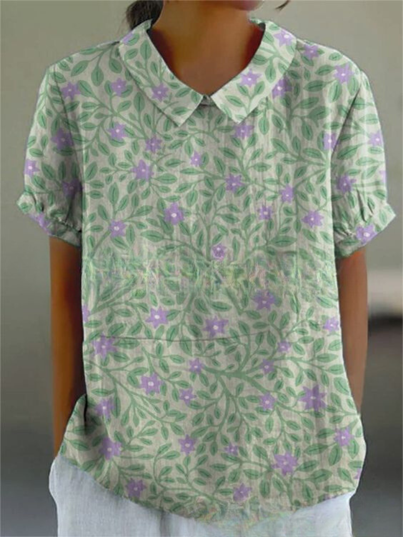 Relaxed fit women's summer top, white with colorful vintage floral embroidery.