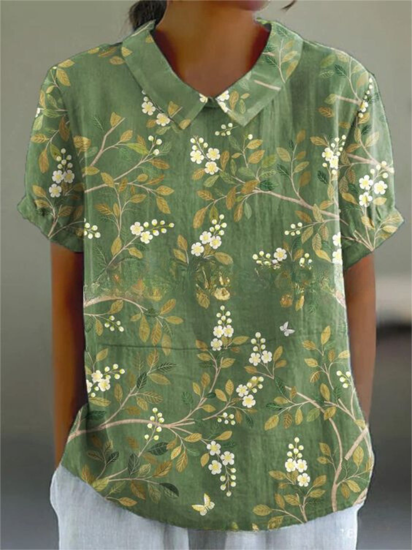 Stylish women's vintage blouse with floral embroidery, ideal for warm weather.