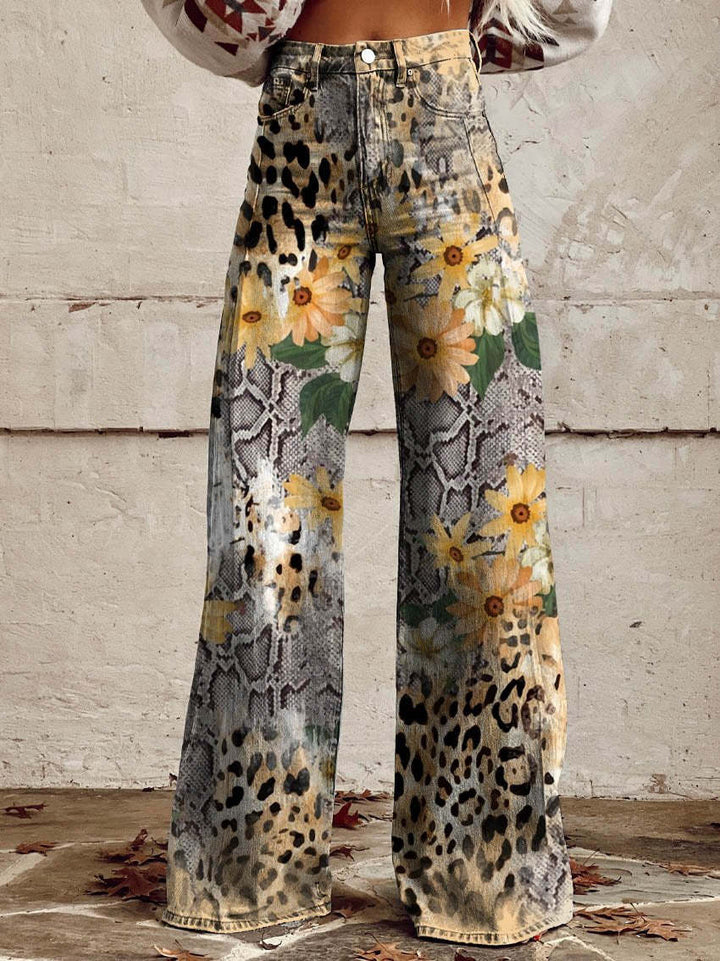 Back view of women's high-waisted wide-leg flare jeans with vintage floral print. Boho casual pants.