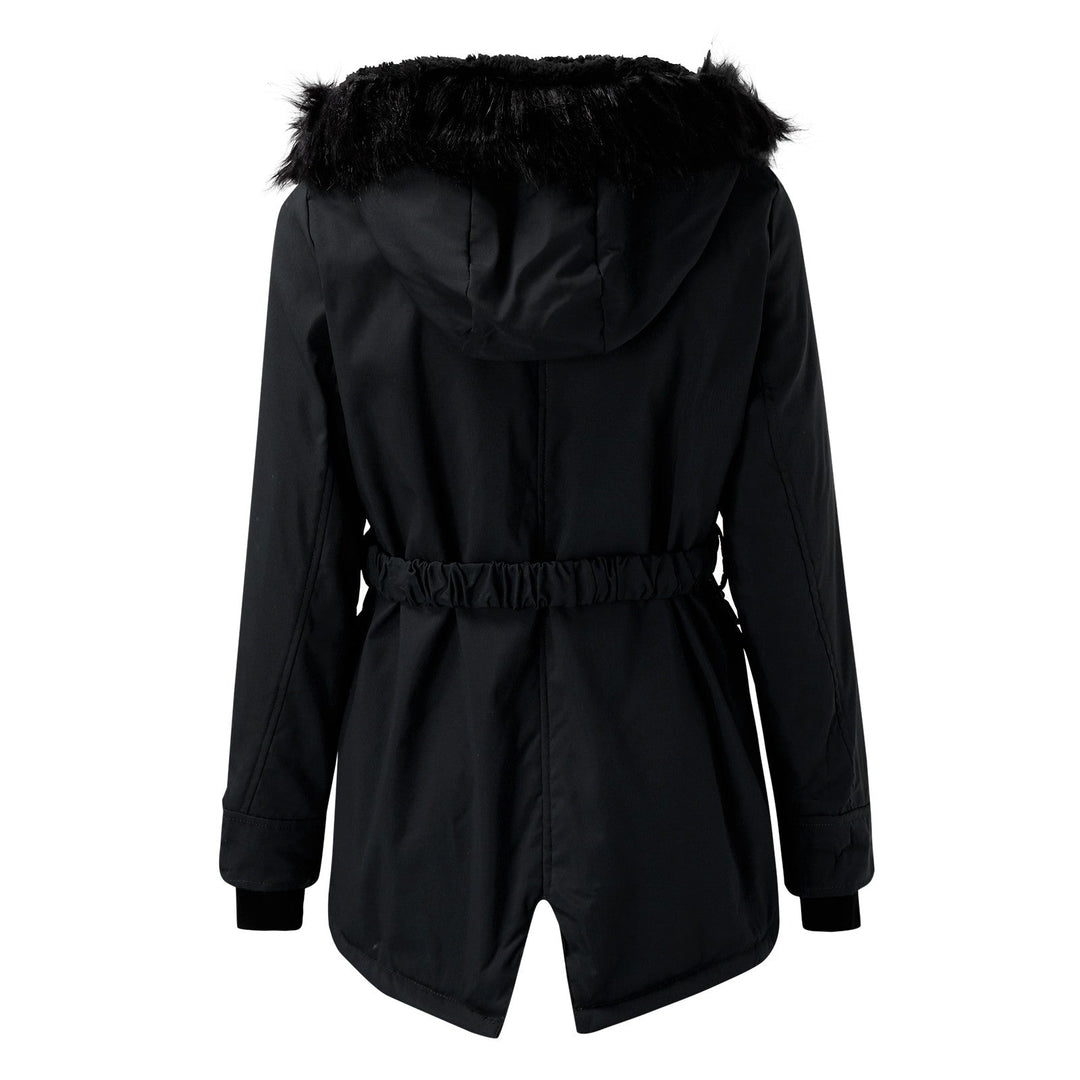 Close-up texture of the puffer material on a women's warm winter coat, durable and cozy.