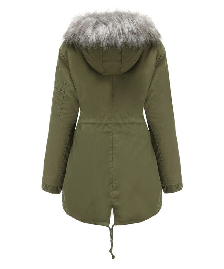 Woman wearing a sherpa-lined parka, ready for a cold weather hike