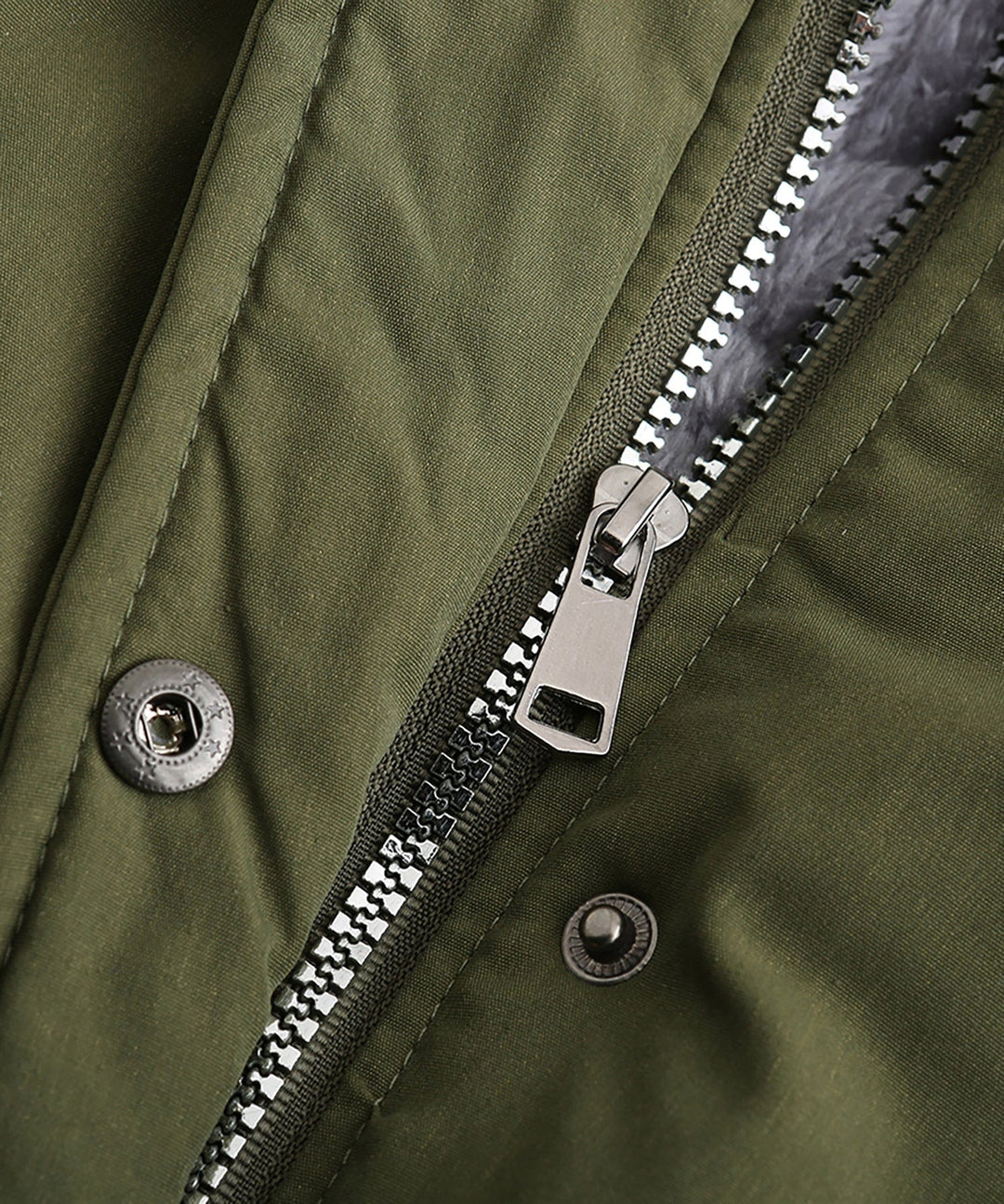 Detail of the durable fabric and stitching on a women's winter parka coat