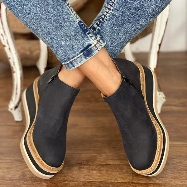 Casual women's waterproof ankle boots with side zipper, providing comfort and style for everyday wear.