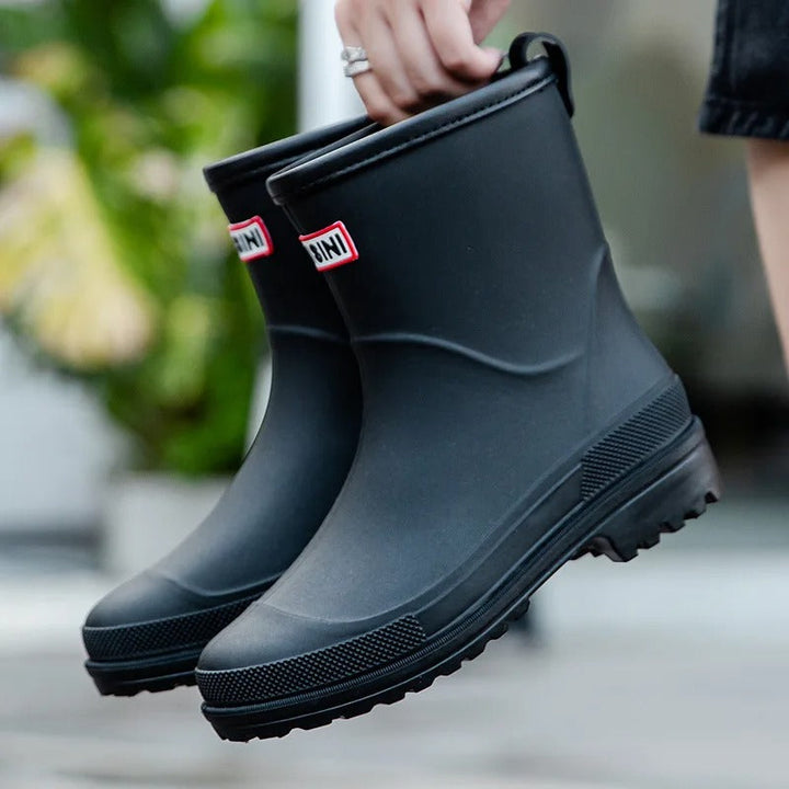 Durable women's waterproof ankle boots. Slip-on for wet weather, ideal outdoor shoes.