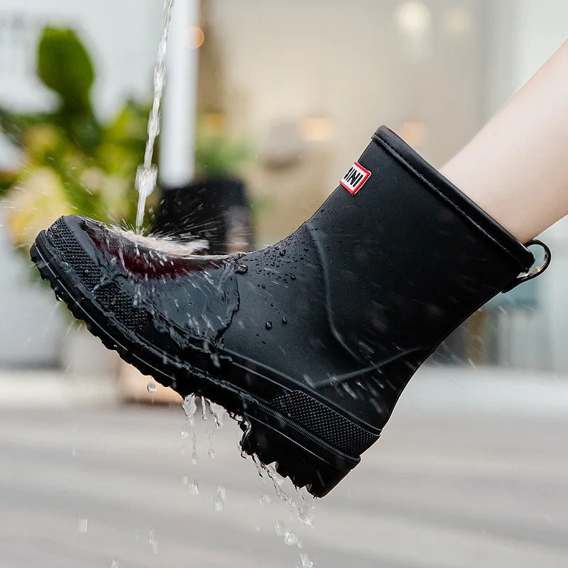Easy-to-wear women's waterproof ankle rain boots, slip-on for wet weather comfort.