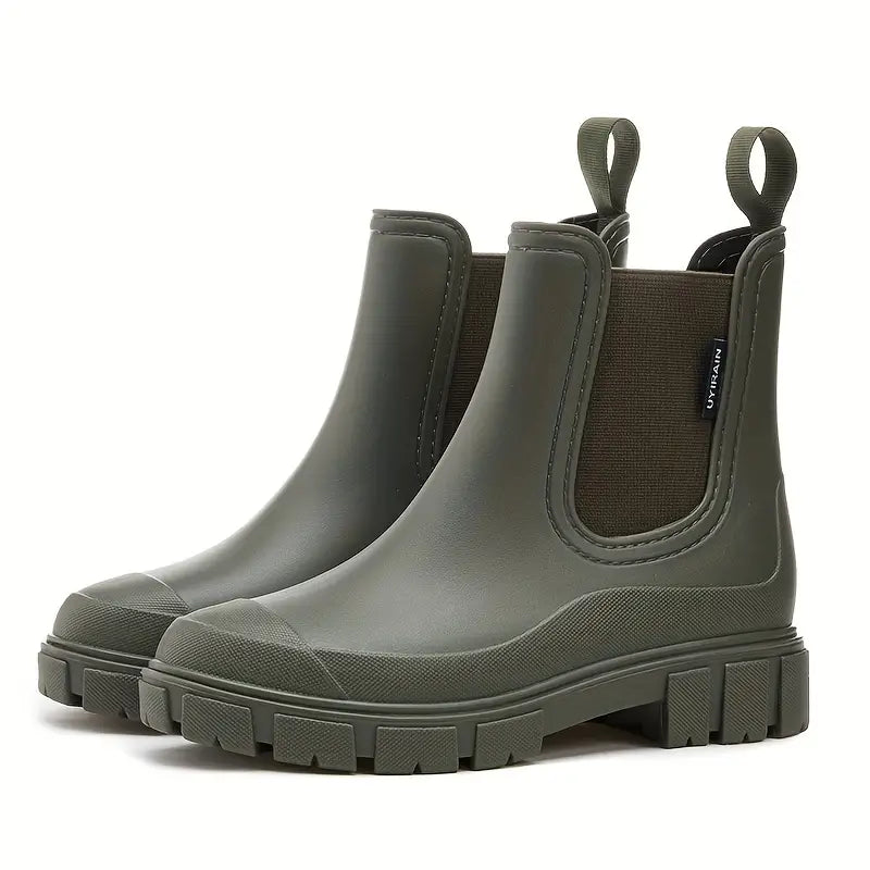 Stylish women's rain boots: black slip-on Chelsea style, offering waterproof protection and all-day comfort.