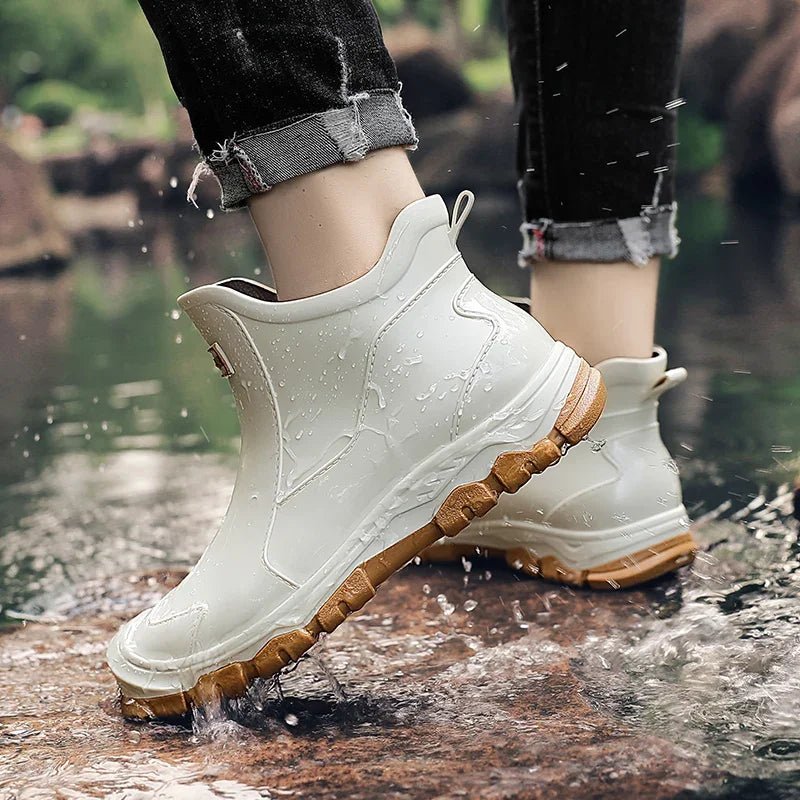 Fashionable women's waterproof Chelsea boots, practical slip-on ankle design for outdoor activities and rain.