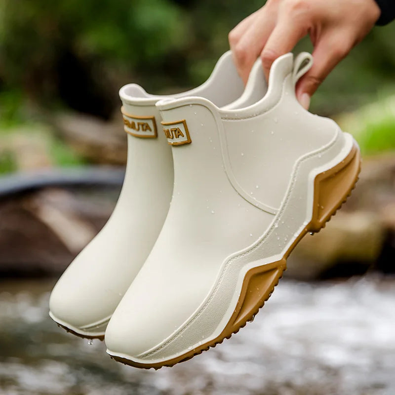Stylish women's fashion rain boots, waterproof slip-on ankle design in a chic finish.