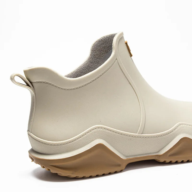 Durable waterproof slip-on ankle rain boots for women, offering comfort and style in any downpour.
