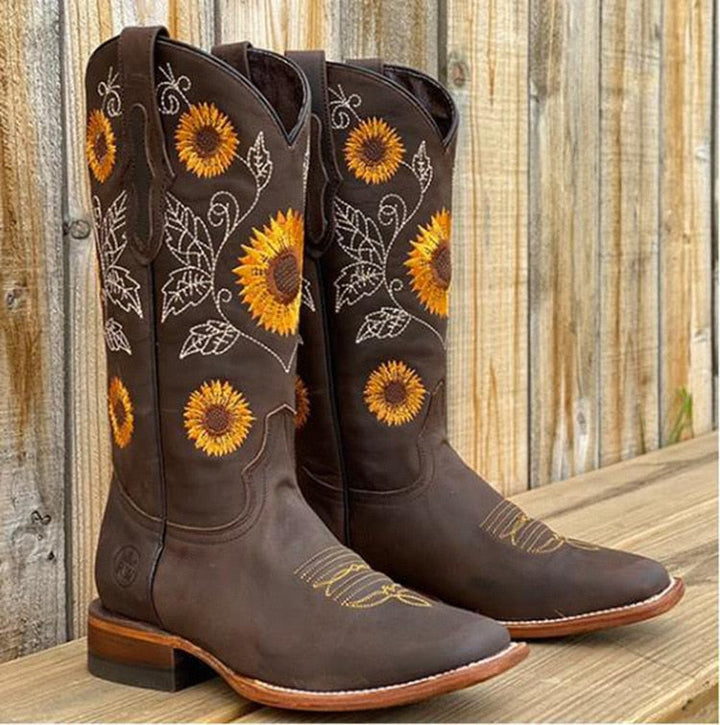 Boho style women's mid-calf cowboy boots featuring intricate sunflower embroidery. Ideal for country fashion and events.