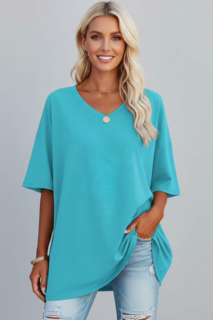 Women's loose fit V-neck t-shirt, showcasing gathered hem detail for style.
