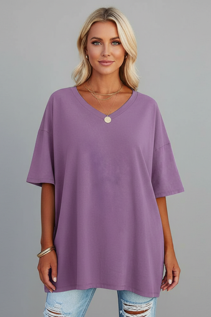 Model wearing a women's V-neck loose fit t-shirt, showcasing relaxed style.