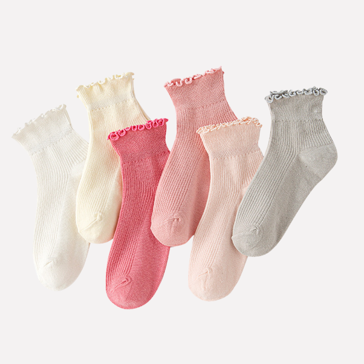 Soft women's ankle socks featuring a charming ruffled cuff, ideal for comfortable and feminine daily wear.