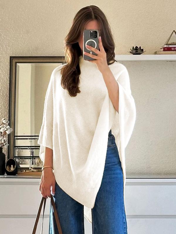 Elegant women's knit asymmetric poncho in a versatile wool blend, a stylish coverup for any occasion