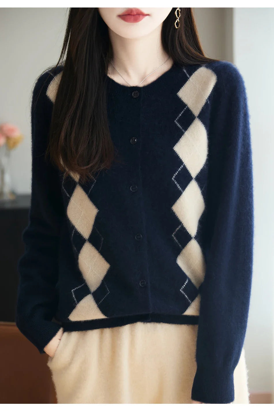 Warm and elegant women's wool knit cardigan with eye-catching diamond stitch. Features button-front.