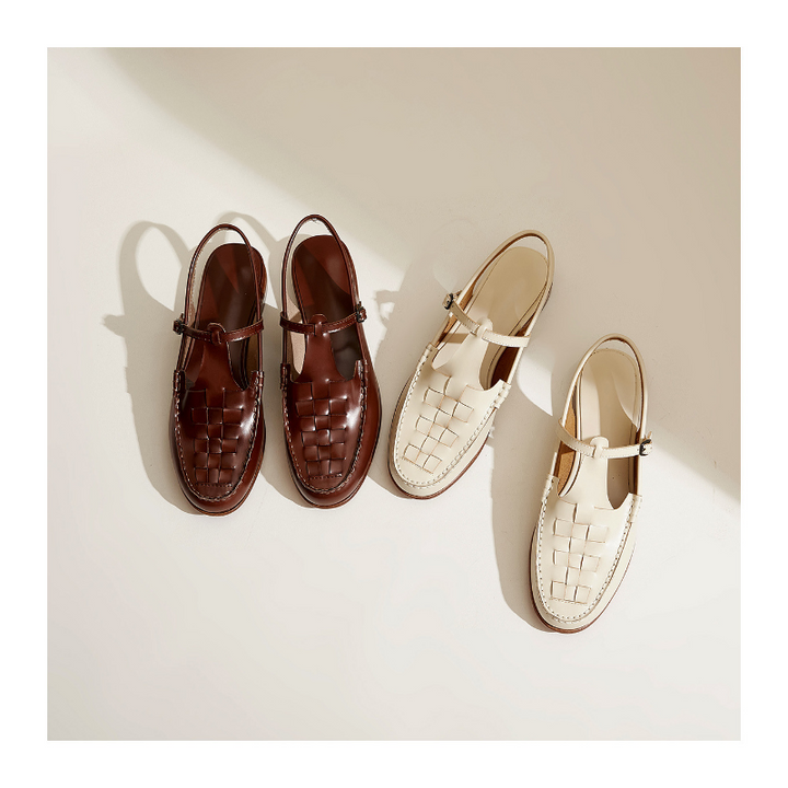 Elegant women's flat sandals with a woven leather upper and secure slingback strap.