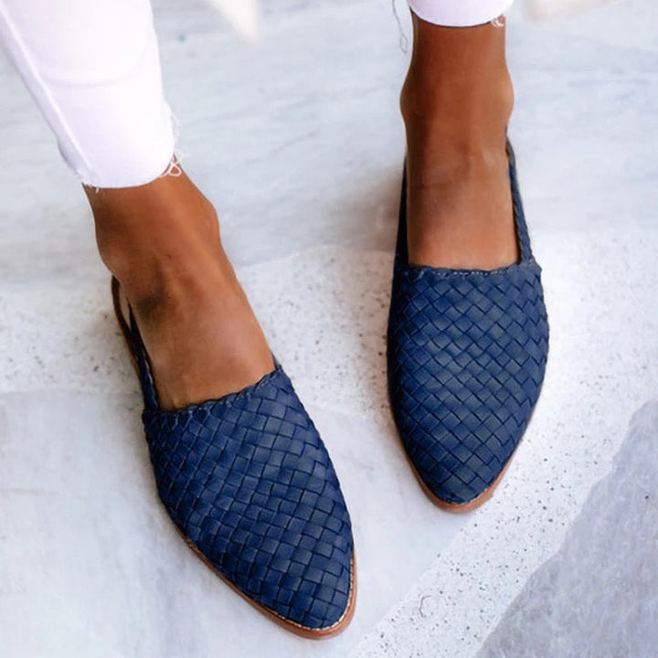 Comfortable slip-on flat sandals for women, stylish closed toe woven mules for versatile wear.