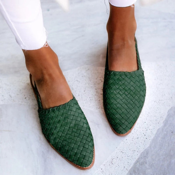 Elegant women's woven closed-toe mules, comfortable flat sandals ideal for smart casual summer outfits.