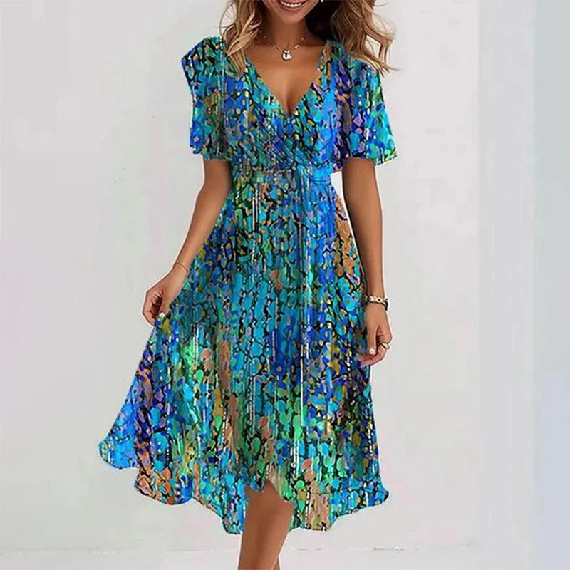 Flowing women's wrap V-neck midi dress with feminine flutter sleeves, great for summer events.