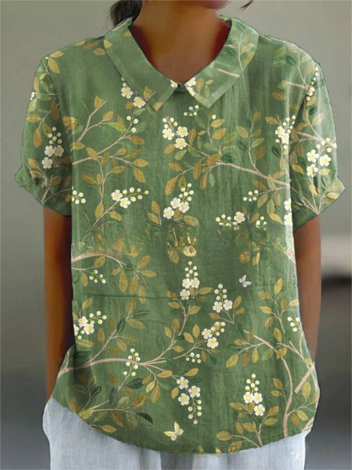 Women's blouse with short gathered sleeves, pointed collar, relaxed fit, perfect for spring-summer style and comfort.