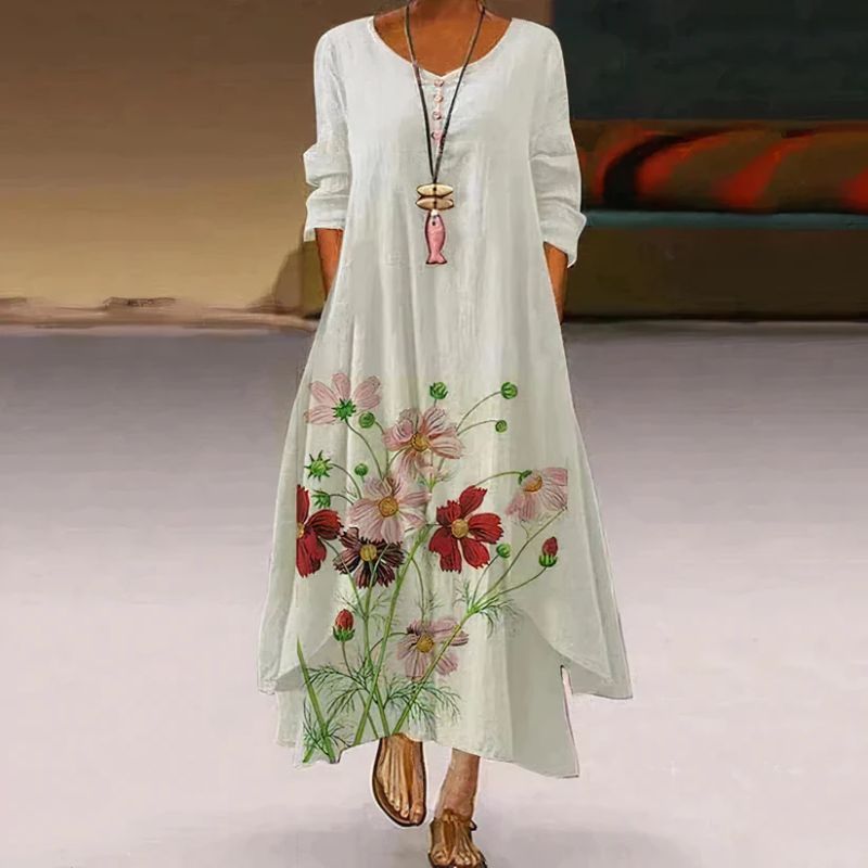 Women's boho maxi dress with long sleeves, layered hem, asymmetrical cut, and relaxed fit; ideal for spring outings.
