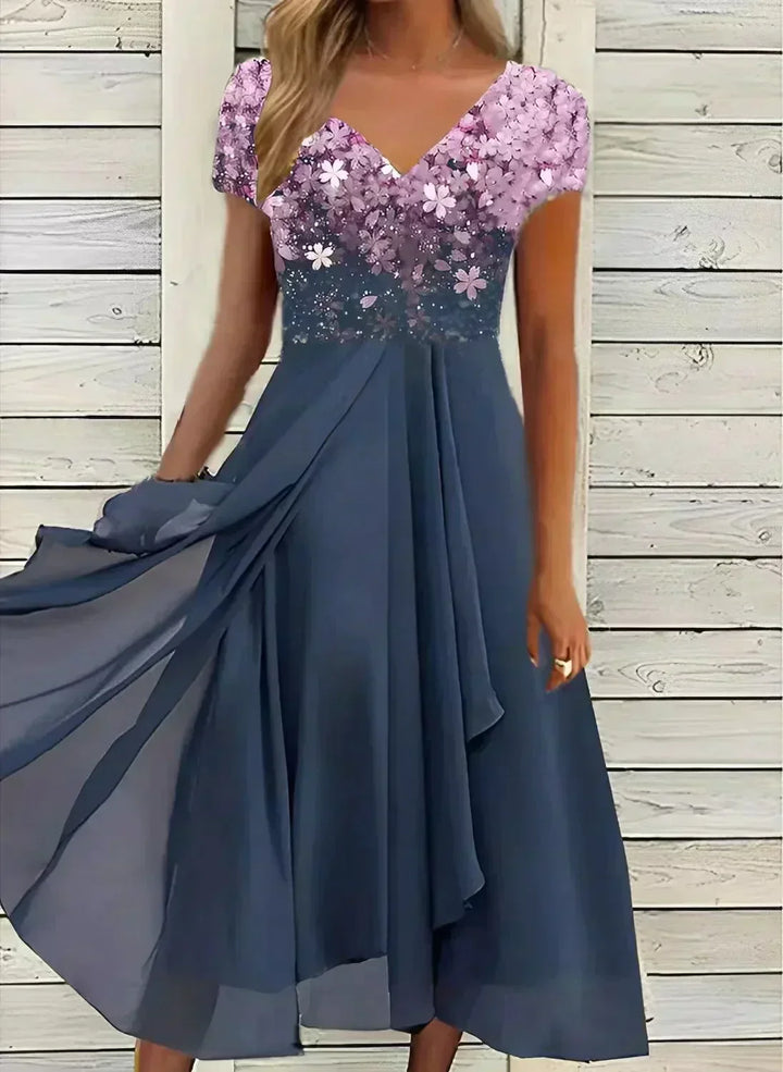 "Women's chiffon evening maxi dress with floral bodice, featuring flowing fabric and shimmering floral design for elegant eve