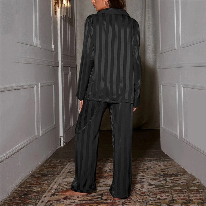 Women's classic striped pajama set with buttoned top and elastic waist pants in breathable fabric for comfort and style.