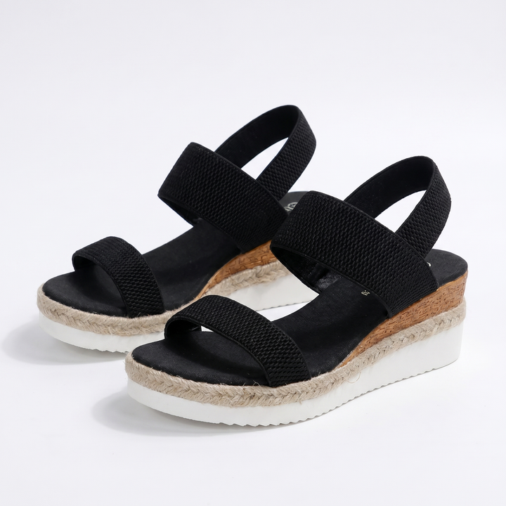 Side view of beige orthopedic wedge sandals, perfect for comfortable summer walking with arch support.