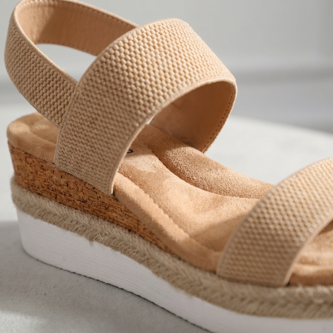 Cushioned footbed of orthopedic wedge sandals, designed for women's ultimate comfort & support.