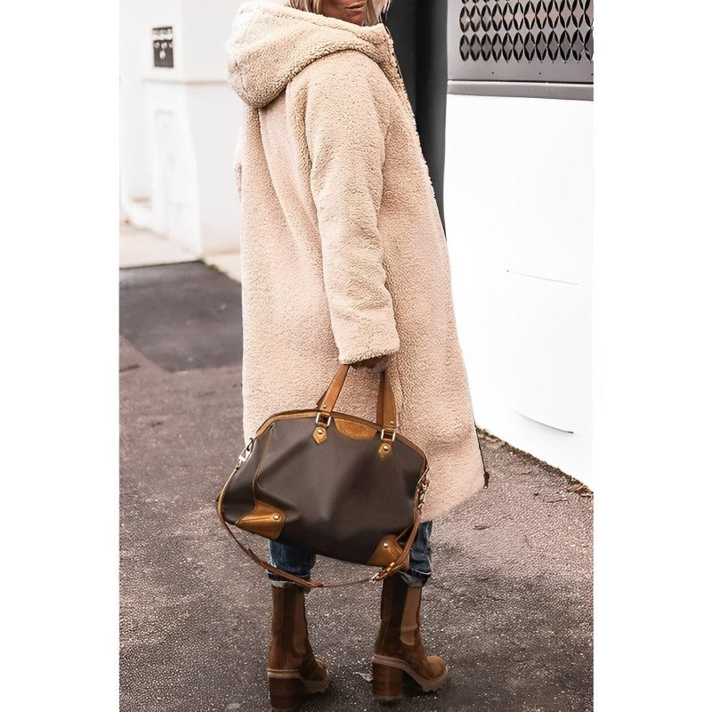 "Women's hooded longline quilted winter coat, front view; insulated, open front design with quilted texture and hood."