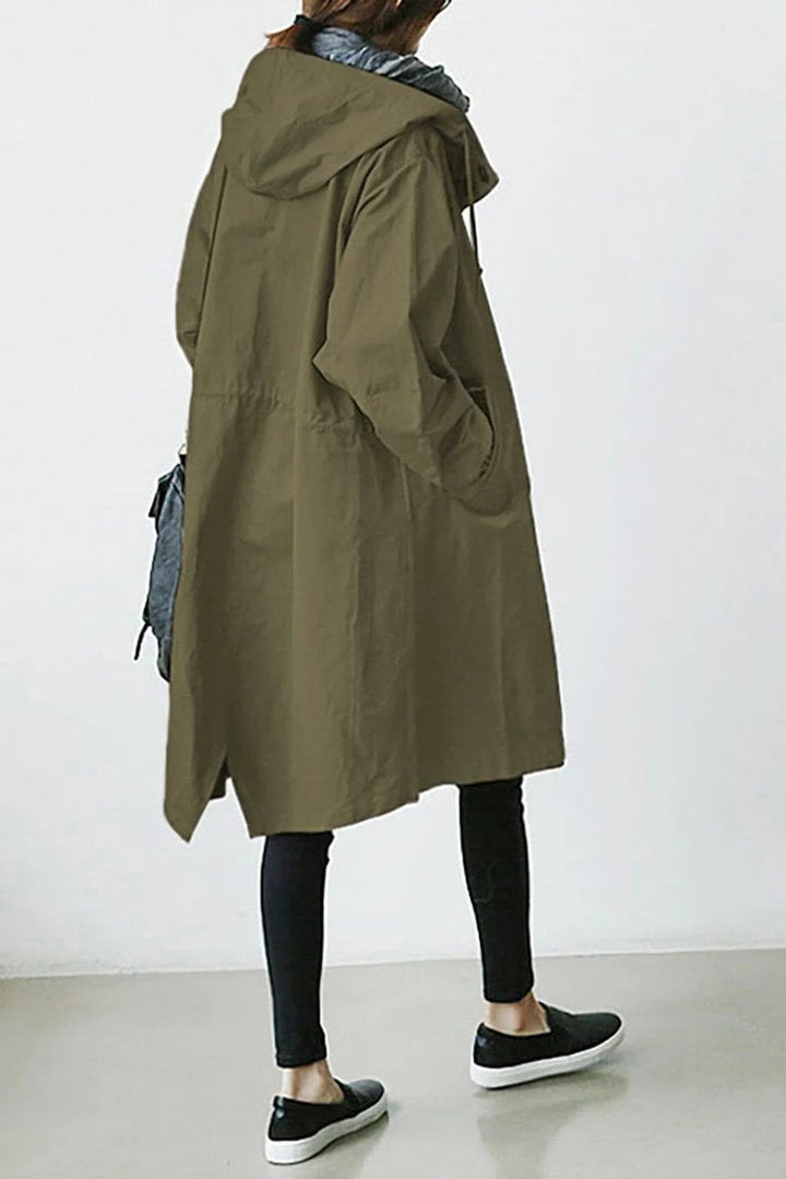 Women's hooded waterproof trench coat, front view. Adjustable hood, belted waist, available in various colors.