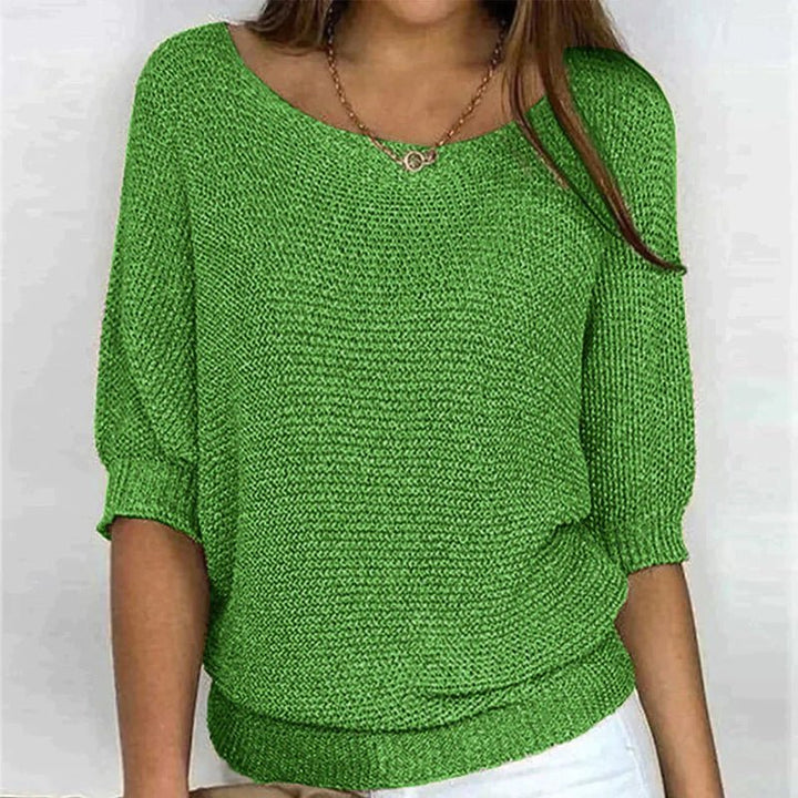 Women's loose knit pullover with half sleeves, wide neckline, textured knit, relaxed fit, ideal for casual elegance.