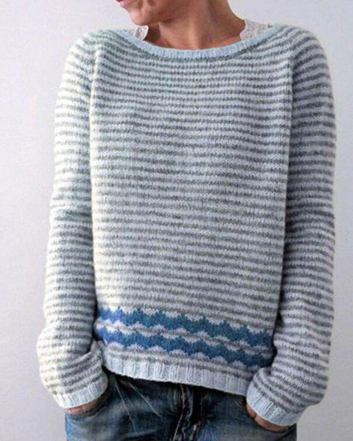 Women's multicolor knit patterned sweater with crew neck, showcasing bold colors and unique design, front view.