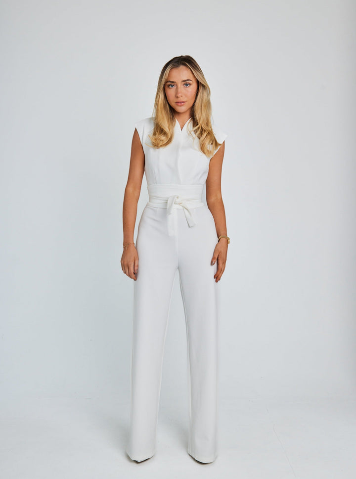 "Women's sleeveless belted jumpsuit with wide-leg, soft fabric, and detachable belt for stylish and comfortable wear."