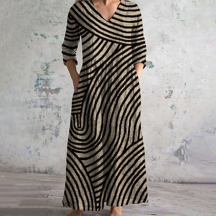 "Women's vintage stripe maxi dress with pockets, featuring a retro stripe pattern and relaxed fit, perfect for all occasions.