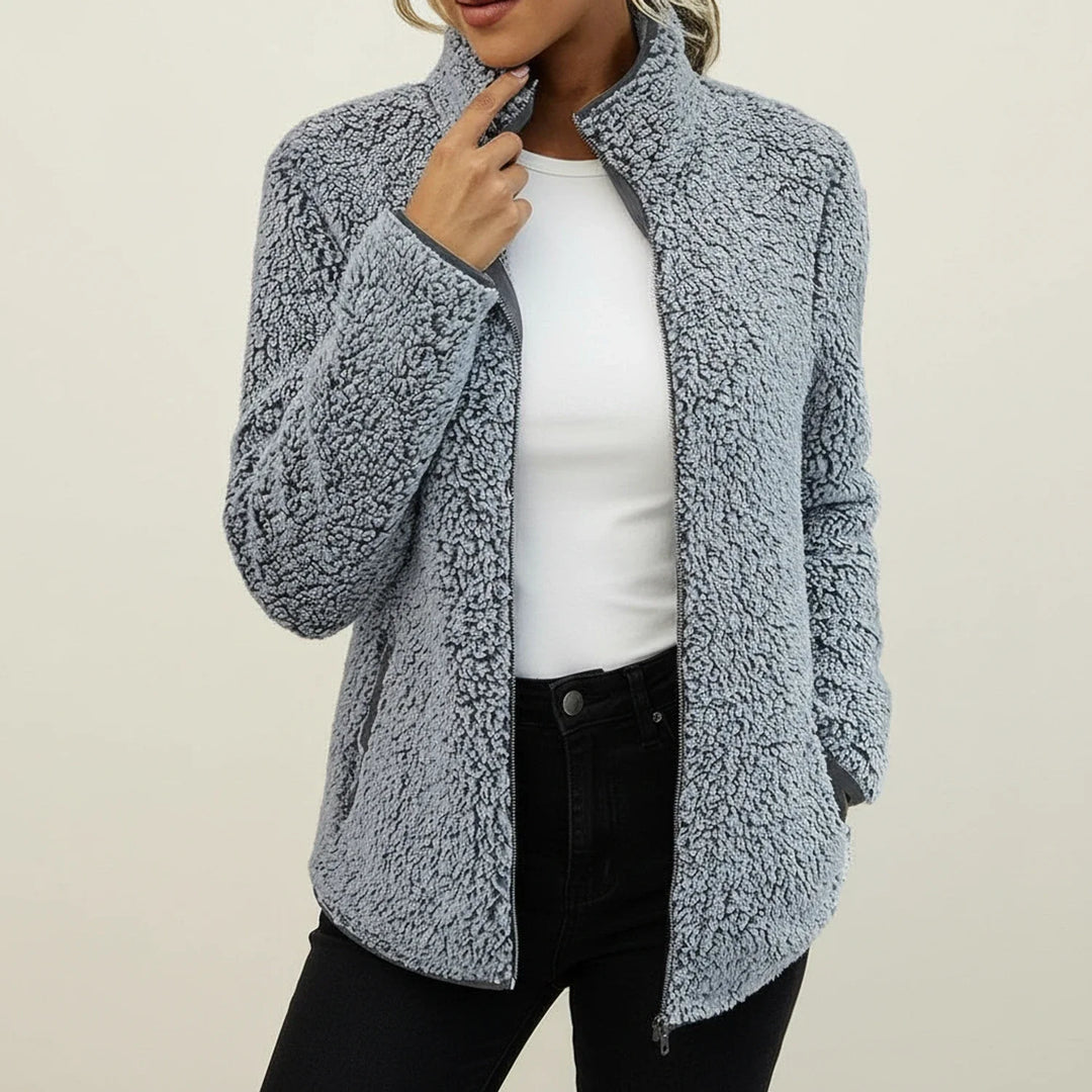 Stylish women's plush winter jacket, warm zip-up coat with a stand collar and relaxed fit for cozy casual wear.