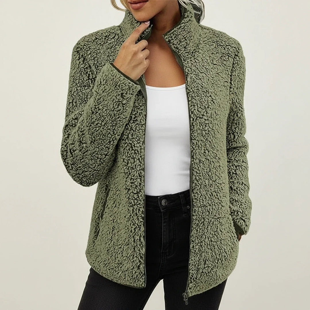 Cozy women's winter jacket, zip-up front, stand collar, plush material, ideal for stylish warmth & everyday wear.